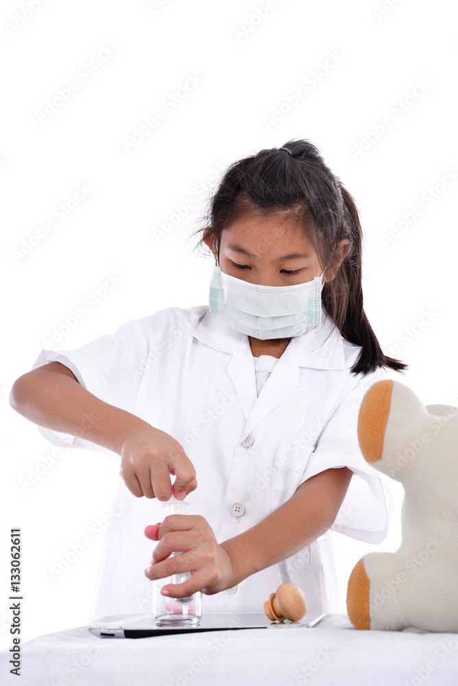 Asian girl pretending to be a doctor wearing healthy mask treame Asian girl pretending to be a doctor wearing healthy mask treame