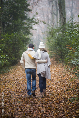 Young couple Walking Winter Woodland