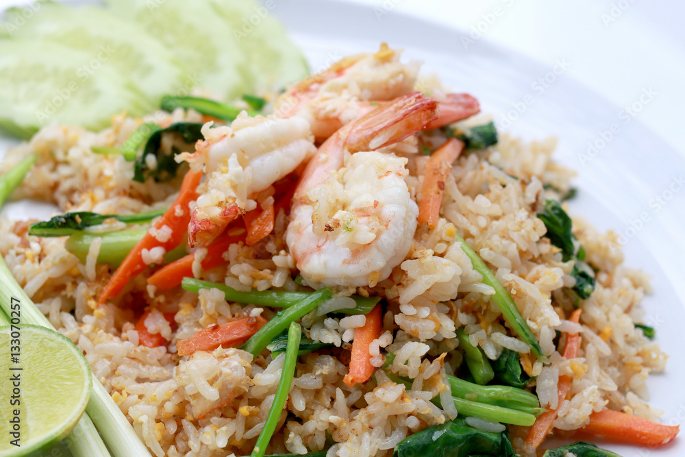 Delicious Shrimp fried rice. Unique style in the white dish on white background, Thai food. Delicious Shrimp fried rice. Unique style in the white dish on white background, Thai food.