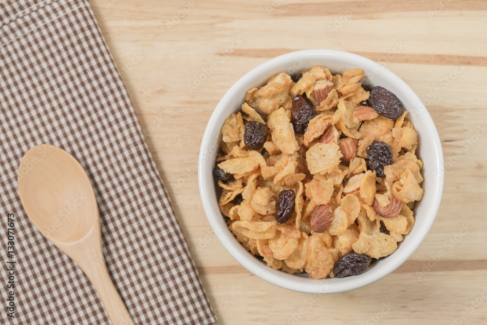 Corn flakes nutrition cereal and milk on wooden surface for healthy breakfast, Top view Corn flakes nutrition cereal and milk on wooden surface for healthy breakfast, Top view