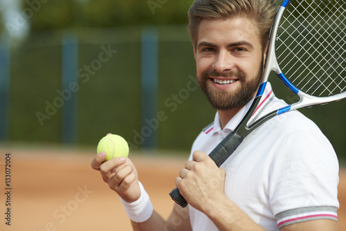 Tennis player while preparing for the game .