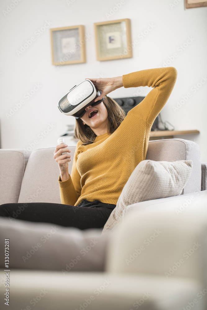young woman uses a virtual reality glasses, VR mask young woman uses a virtual reality glasses, VR mask