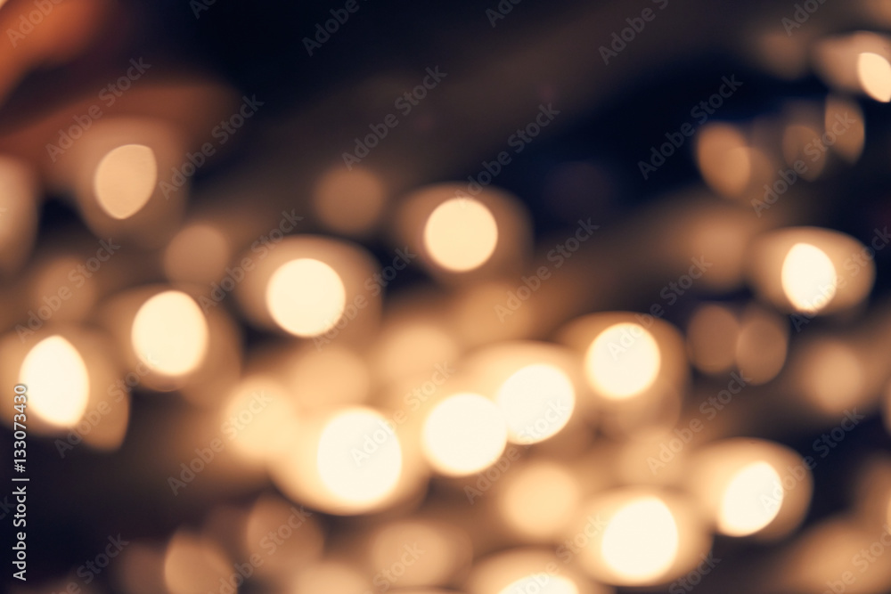 Blurred abstract background of candle lights, bokeh in cool vintage color tone Blurred abstract background of candle lights, bokeh in cool vintage color tone
