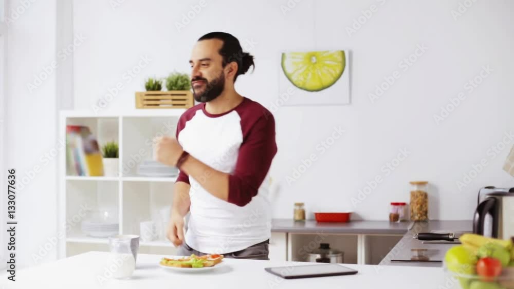 man eating breakfast and dancing at home man eating breakfast and dancing at home