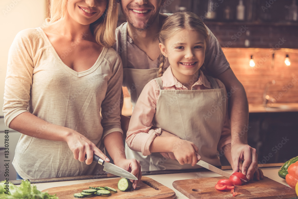 Fototapeta premium Young family cooking