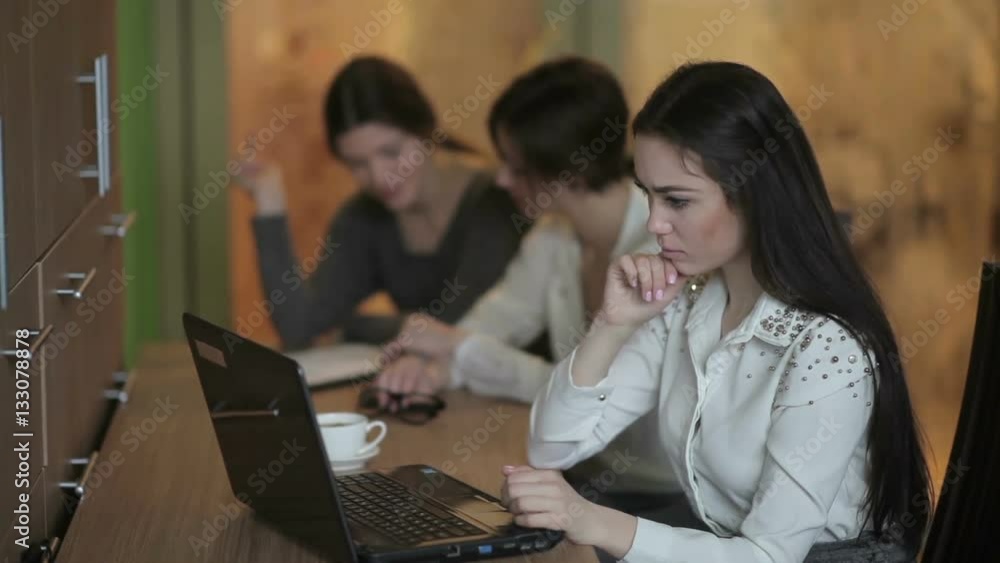 Girl pushes the buttons of laptop Girl pushes the buttons of laptop