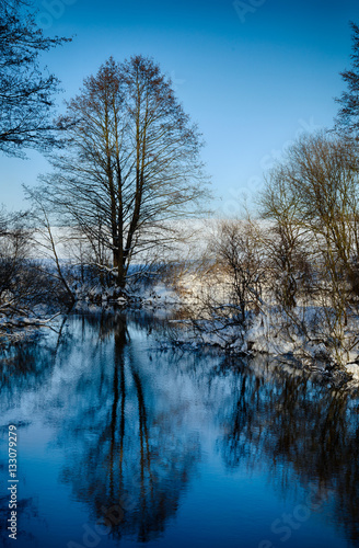Beautiful cold winter landscape, Beautiful winter river in a frosty day,Very cold winter, The river crosses the icy wilderness, Sunny winter day