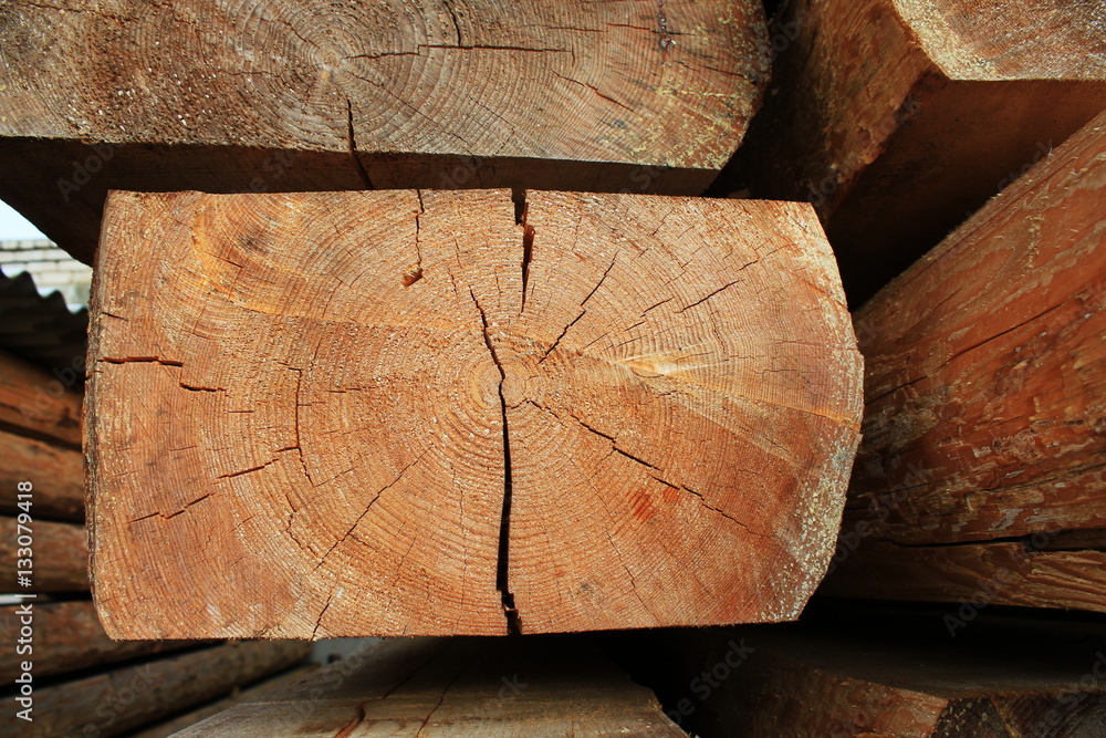 Wooden beams - building material of roof , wooden components for carpenter work. Oak background. Wooden beams - building material of roof , wooden components for carpenter work. Oak background.