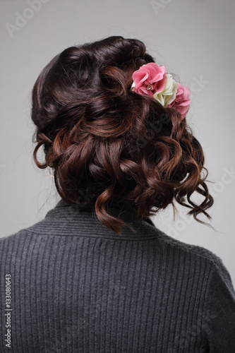 wedding hairstyle from curls and flowers