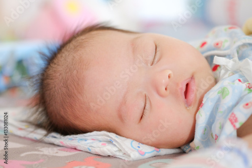 Newborn Asian baby girl sleeping