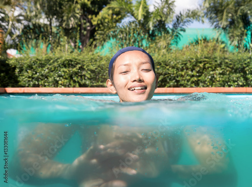woman in a bathing cap swim in the pool © milkovasa
