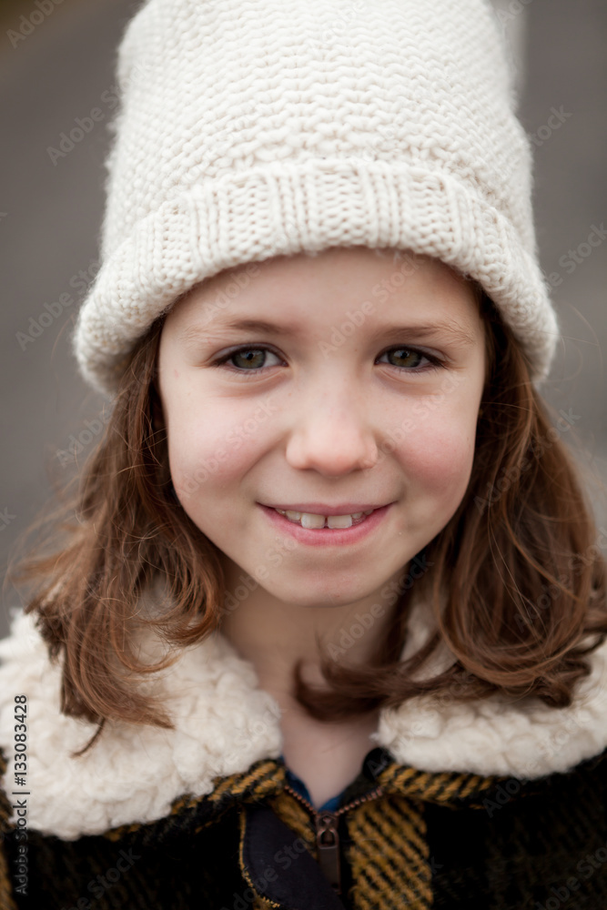 Beautiful girl with wool hat at winter