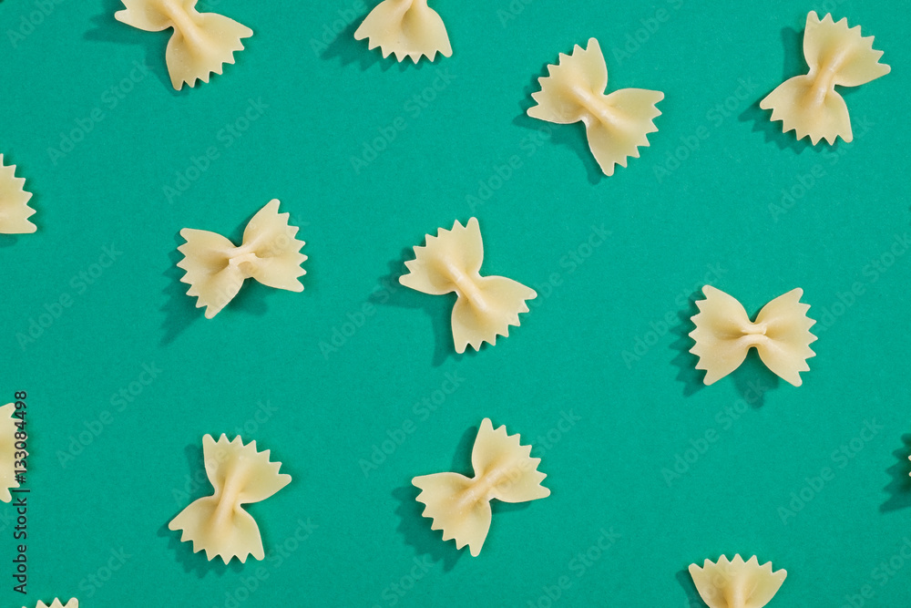 Fototapeta premium Farfalle pasta flat lay pattern