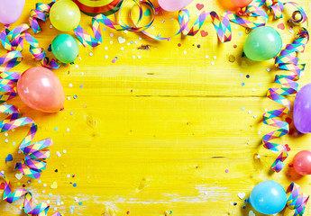 Bright colorful carnival or party frame on yellow
