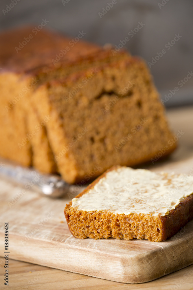 Traditional Dutch spice bread or 'ontbijtkoek' with butter Traditional Dutch spice bread or 'ontbijtkoek' with butter
