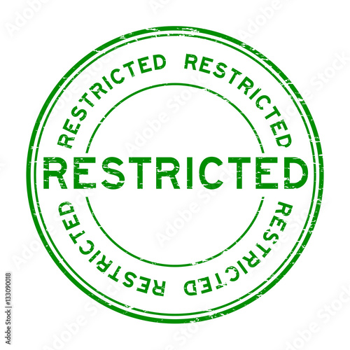 Grunge green restricted round rubber stamp on white background