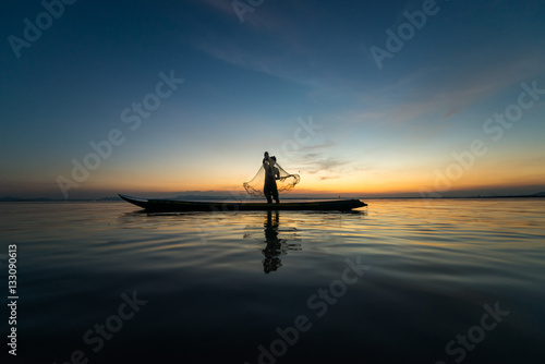 Fishermans in action when fishing at sunset time,Asia,Thailand