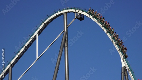 People On Roller Coaster Thrill Ride