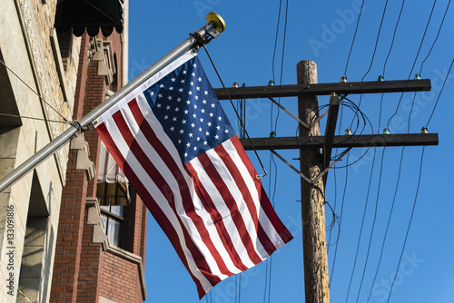 American flag in front of a city photo