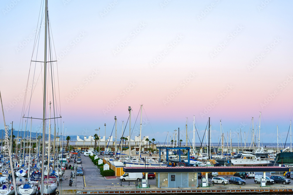 Boats at the Pier in Port Olimpic Barcelona, Spain. Warm Sunset