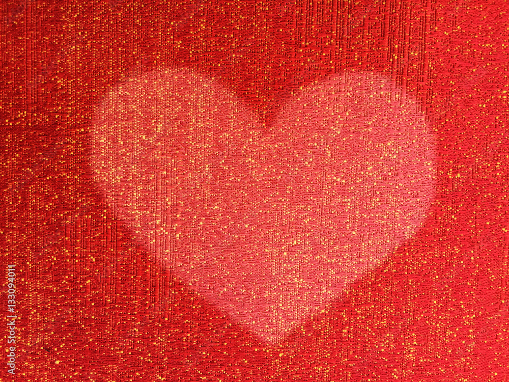 Heart shape on red fabric background texture Heart shape on red fabric background texture