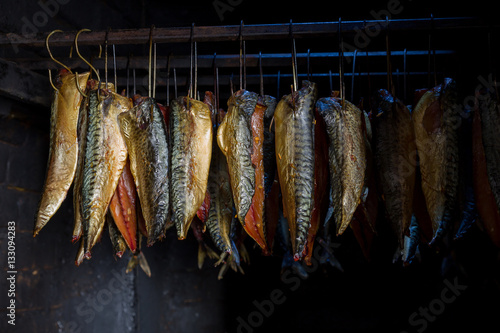 Fish processing plant. Fish of cold (hot) smoked. Smoked Fish In Smokehouse Box. Smoked Mackerel, Close Up Smoking Process Fish For Home Use. Smoked Mackerel, Preparation Of Organic Food.
