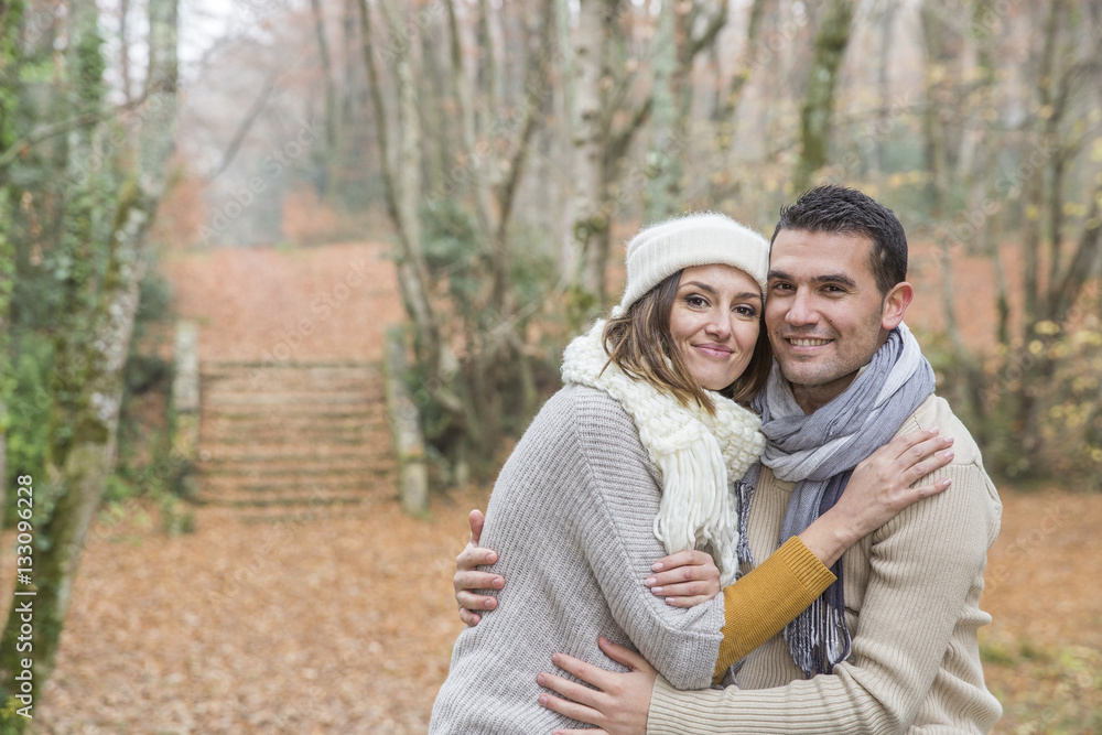 Fototapeta premium Young couple Walking Winter Woodland