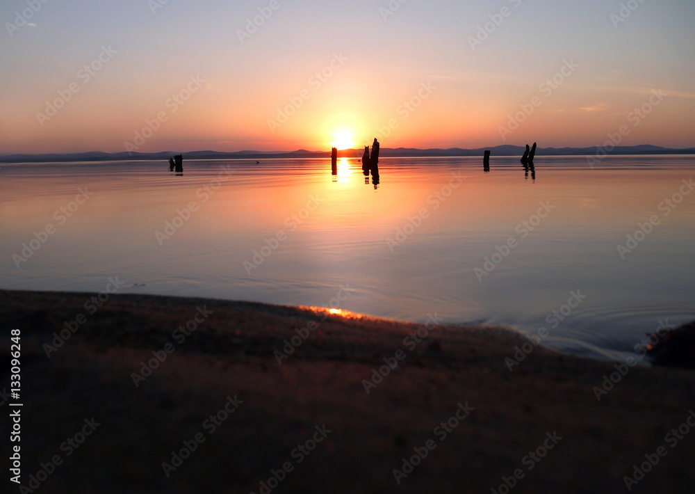 Picturesque sunset on the lake. Lake Uvildy, Chelyabinsk oblast, Russia. Picturesque sunset on the lake. Lake Uvildy, Chelyabinsk oblast, Russia.