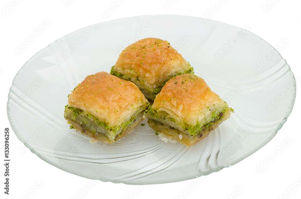 Baklava with pistachio on a white background