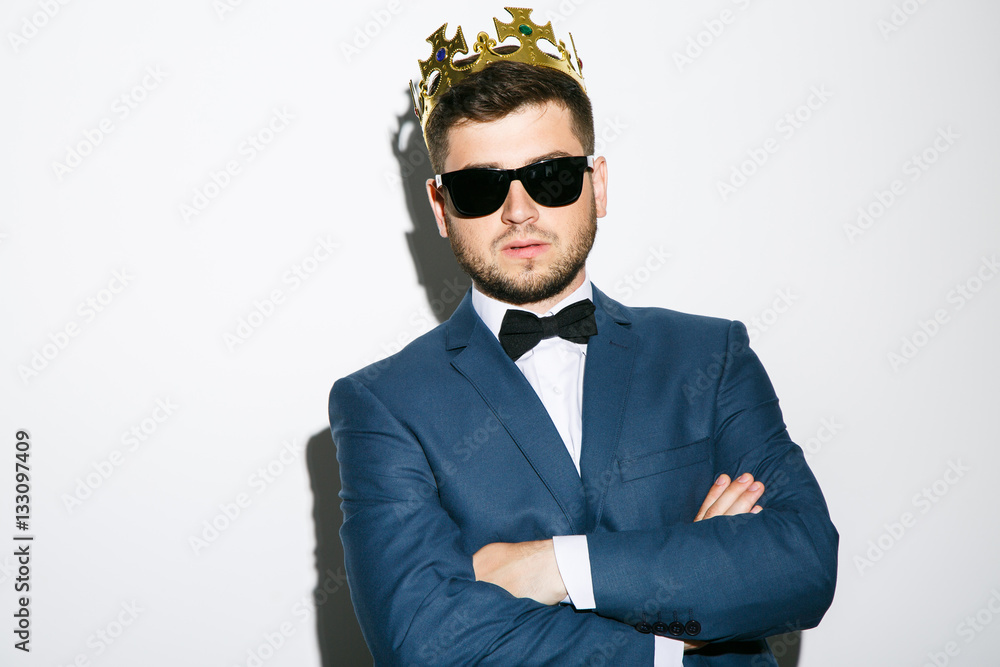 Serious young man with crown Serious young man with crown