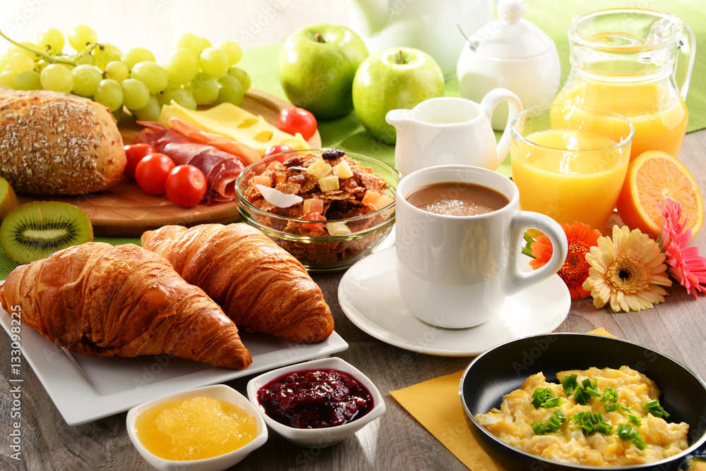 Breakfast served with coffee, juice, egg, and rolls Breakfast served with coffee, juice, egg, and rolls