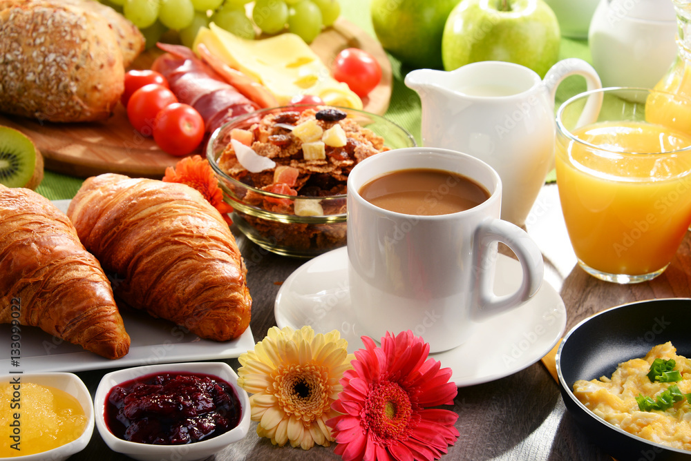 Breakfast served with coffee, juice, egg, and rolls Breakfast served with coffee, juice, egg, and rolls