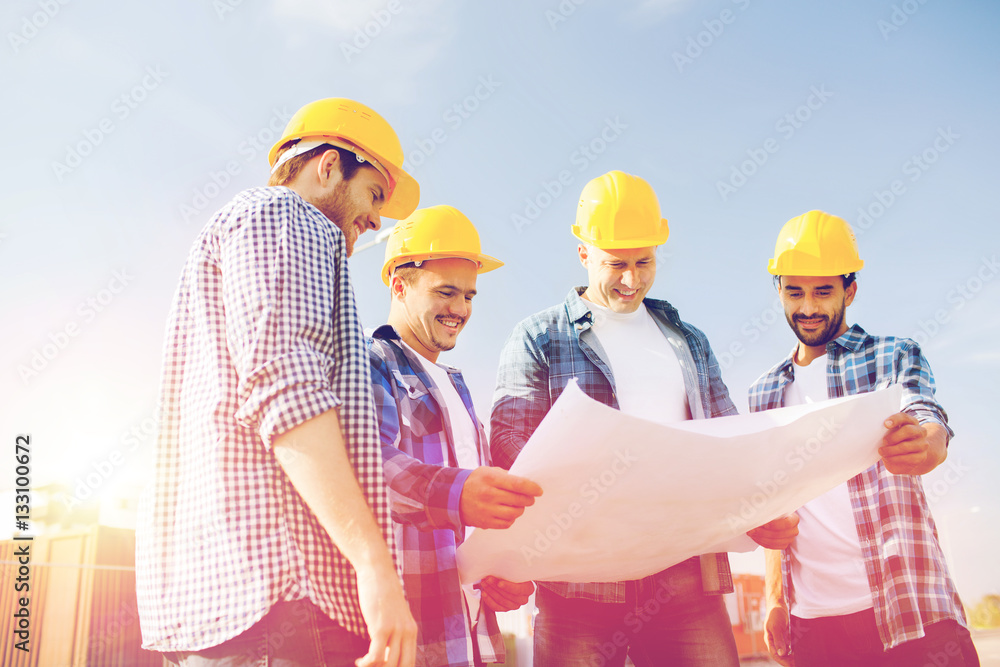 group of builders with tablet pc and blueprint group of builders with tablet pc and blueprint