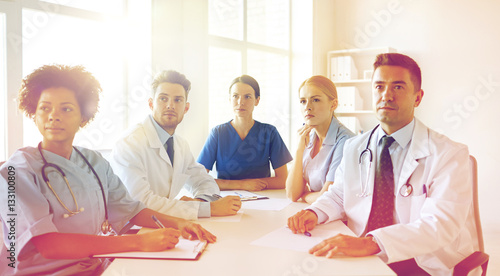 group of happy doctors meeting at hospital office