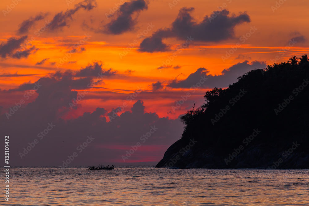 golden sunset behind the island