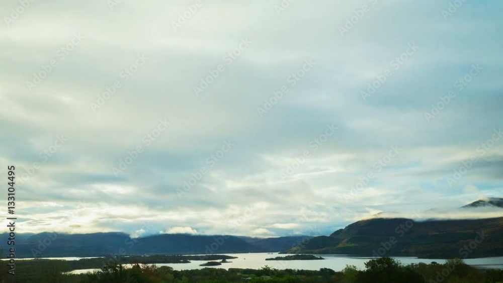 Beautiful timelapse shot of clouds rolling over mountains and lake. Idyllic view of soft cloudscape moving in sky. Scenic view of serene nature. 4K resolution. Beautiful timelapse shot of clouds rolling over mountains and lake. Idyllic view of soft cloudscape moving in sky. Scenic view of serene nature. 4K resolution.