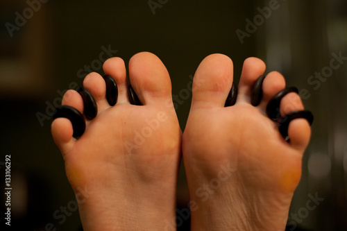 Massage of female foot in spa salon. Healthy lifestyle and relaxation concept. Close up