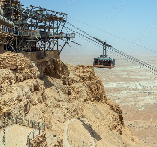 The cable car transporting passengers in ancient fortress Masada - Israel photo