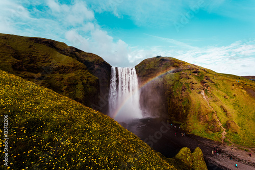 Scenic view of waterfall and rainbow