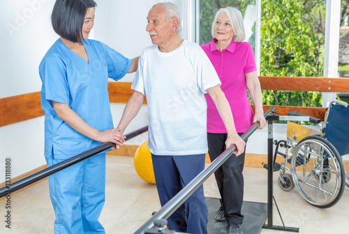 Senior patients being assisted by physical therapist