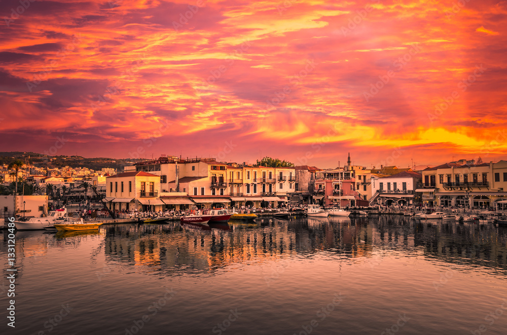 RETHYMNO, CRETE ISLAND, GREECE  JUNE 29, 2016: Stunning sunset over the old venetian port of Rethimno on Crete island Greece.