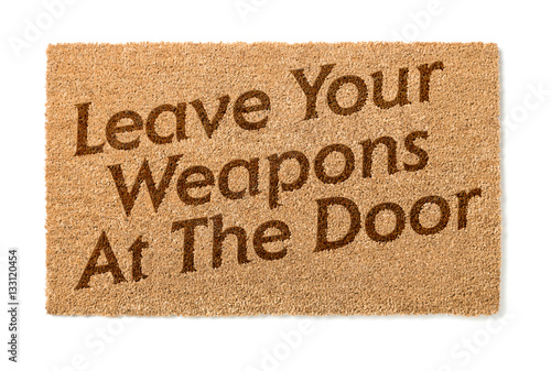Leave Your Weapons At The Door Welcome Mat Isolated On A White Background.