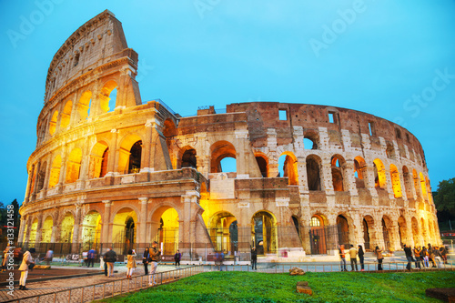 The Colosseum with people at night