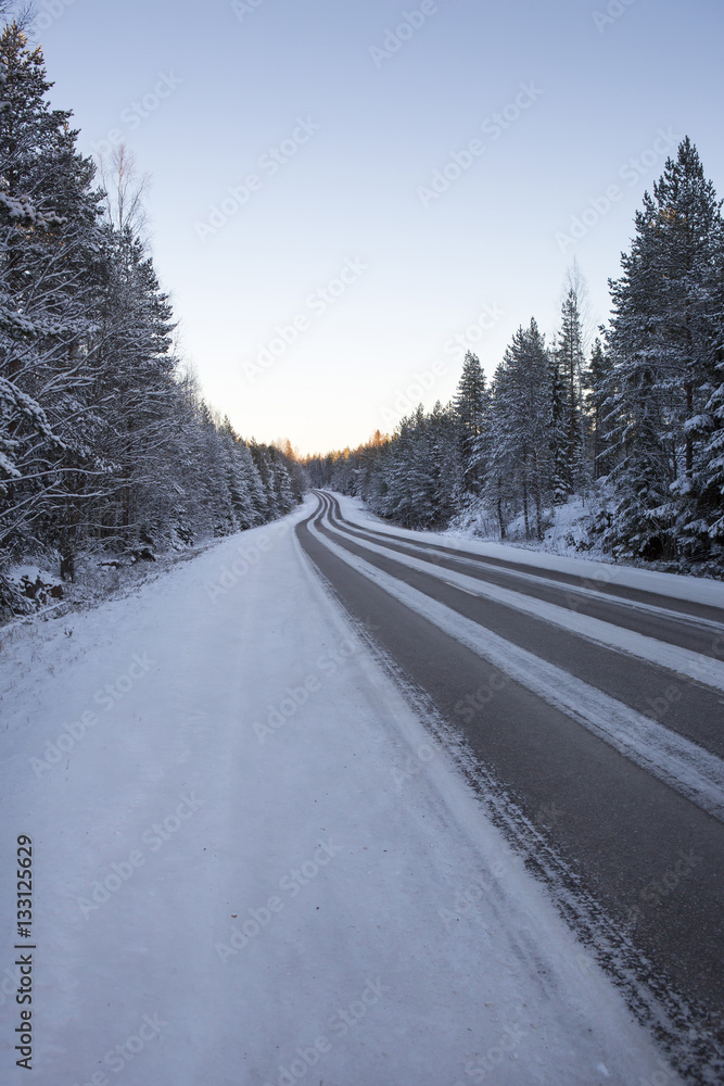 Traveling early in the morning. Image taken during sunrise on a cold winter morning in Finland. Traveling early in the morning. Image taken during sunrise on a cold winter morning in Finland.