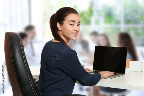 Young businesswoman working...