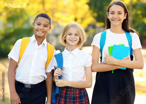 Teenagers with backpacks an...