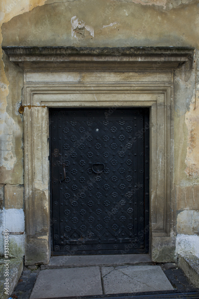 Wrought iron black door with a pattern in Lviv