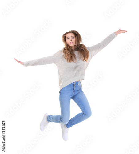 Pretty teenager girl  jumping on white background © Africa Studio