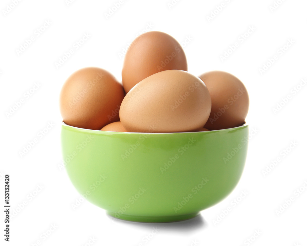 Raw eggs in bowl on white background Raw eggs in bowl on white background