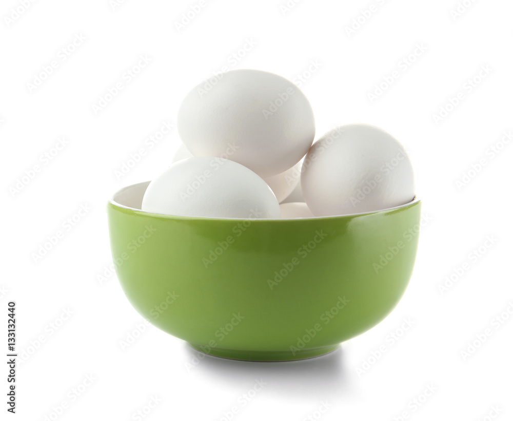Raw eggs in bowl on white background Raw eggs in bowl on white background